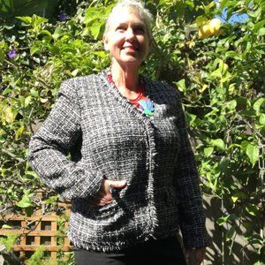 Black/white woven women's jacket with red lining